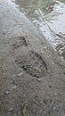 Foot print sand water stone Royalty Free Stock Photo