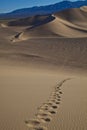 Foot prints of human on a sand dune. Royalty Free Stock Photo