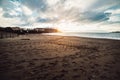 Foot prints on the ocean beach sand at sunset time Royalty Free Stock Photo