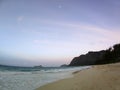 Foot prints in the sand as Gentle wave lap on Waimanalo Beach