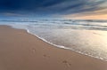 Foot prints on sand beach at sunset Royalty Free Stock Photo