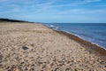 Foot prints and shadows on a sandy beach Royalty Free Stock Photo