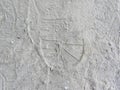 Foot prints of shoes on gray sand Royalty Free Stock Photo