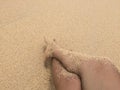 Foot and sand in the beach Royalty Free Stock Photo