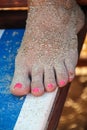 Foot with sand powdered on stool
