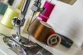 Foot sewing machine with colored threads Royalty Free Stock Photo