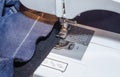 Foot of Sewing Machine on Jeans Fabric Royalty Free Stock Photo