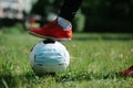 Foot and shoe with soccer football with face mask for sports during covid-19 pandemic Royalty Free Stock Photo