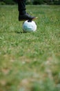 Foot and shoe with soccer football with face mask for sports during covid-19 pandemic Royalty Free Stock Photo