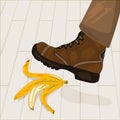 Foot in shoe step on banana peel. Leg stepping on dangerous slippery yellow fruit skin lying on sidewalk.