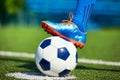 Foot of soccer player in football boot on ball Royalty Free Stock Photo