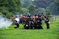 Foot soldiers firing muskets during a re-enactment. Royalty Free Stock Photo