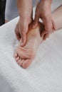 Professional reflexology foot massage close up Royalty Free Stock Photo