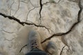 foot standing on visible ground fault line