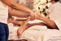 Foot therapist, massage and people at spa for acupressure treatment, holistic therapy or beauty salon. Closeup of feet Royalty Free Stock Photo