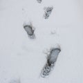 Foot traks in the snow, street covered with snow