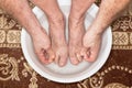 Foot washing in washbasin Royalty Free Stock Photo