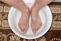 Foot washing in washbasin Royalty Free Stock Photo