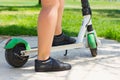 Foot of woman stepping on electric scooter Royalty Free Stock Photo