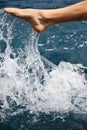 Foot of young man in water - splash