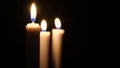 Footage of candles are lit in the darkness. Christmas Royalty Free Stock Photo