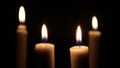 Footage of closeup of candle on black background. Christmas