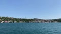 Footage of cruise tour boat passing in Cengelkoy area of Istanbul on Asian side on Bosphorus. Beautiful scene.