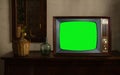 footage of Dated TV Set with Green Screen Mock Up Chroma Key Template Display, Nostalgic living room with furniture and old mirror Royalty Free Stock Photo