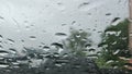 footage of rain on the glass, large raindrops are flowing down