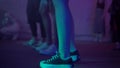 Footage of young people's feet and legs dancing in the Night Club at Music Party