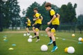 Football Academy For Teens. Youth Football Player in Soccer Ball Control Drills. Young Boys in the Football Team At Workout