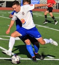 Football action for the loose ball Royalty Free Stock Photo