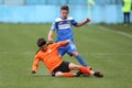 Football action - sliding tackle Royalty Free Stock Photo