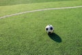 Football on artificial turf. It is for green background in a stadium Royalty Free Stock Photo