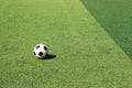Football on artificial turf. It is for green background in a stadium Royalty Free Stock Photo