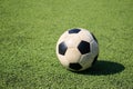 Football on artificial turf. It is for green background in a stadium Royalty Free Stock Photo