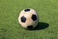 Football on artificial turf. It is for green background in a stadium Royalty Free Stock Photo