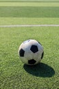 Football on artificial turf. It is for green background in a stadium Royalty Free Stock Photo