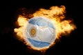 Football ball with the flag of argentina on fire Royalty Free Stock Photo