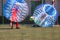 Football ball game in inflatable transparent spheres. sports and entertainment. active recreation and hobbies