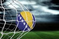 Football in bosnia and herzegovina colours at back of net