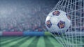 FC Barcelona football club logo on the ball in football net. Editorial conceptual 3D rendering