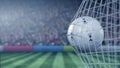 Tottenham Hotspur football club logo on the ball in football net. Editorial conceptual 3D rendering