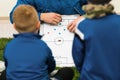 Football Coach Coaching Kids. Young Soccer Players Listening Coaches Tactics and Motivational Talk