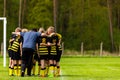 Football Coaching. Young Boys Having Pep Talk with Coach Before the Tournament Match. Kids Soccer Academy Team on the Pitch