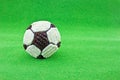 Football cupcake on green grass Royalty Free Stock Photo