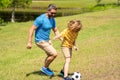 football family team of father and son. soccer activity. Fatherhood in outdoor of daddy and son kid. daddy with son