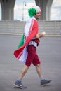 Football fan of Iran at 2018 FIFA world cup in Russia dressed in Iranian flag