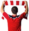 Football fan in red holding scarf Royalty Free Stock Photo