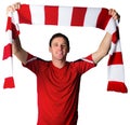 Football fan in red holding scarf Royalty Free Stock Photo